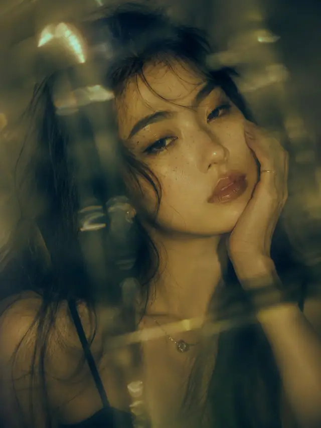 Generated result showing an olive-green cinematic portrait with close wide-angle perspective and glass refraction